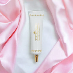 F.A.R.A.H. Smooth Focus Face Primer displayed with makeup essentials for a complete routine.